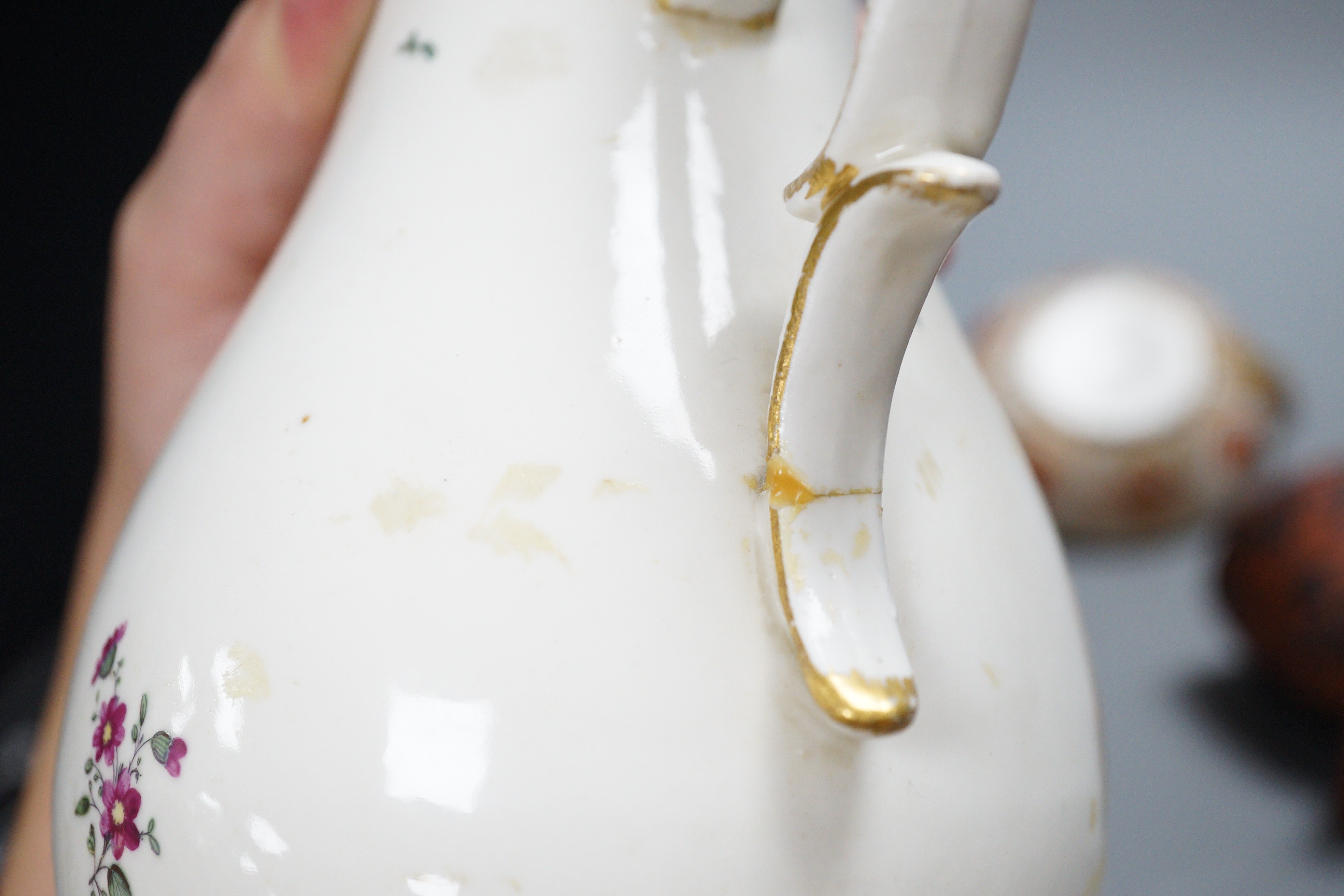 An 18th century English porcelain hot water jug, a Wedgwood two-colour terracotta pot and an early 19th century oil lamp, tallest 20cm